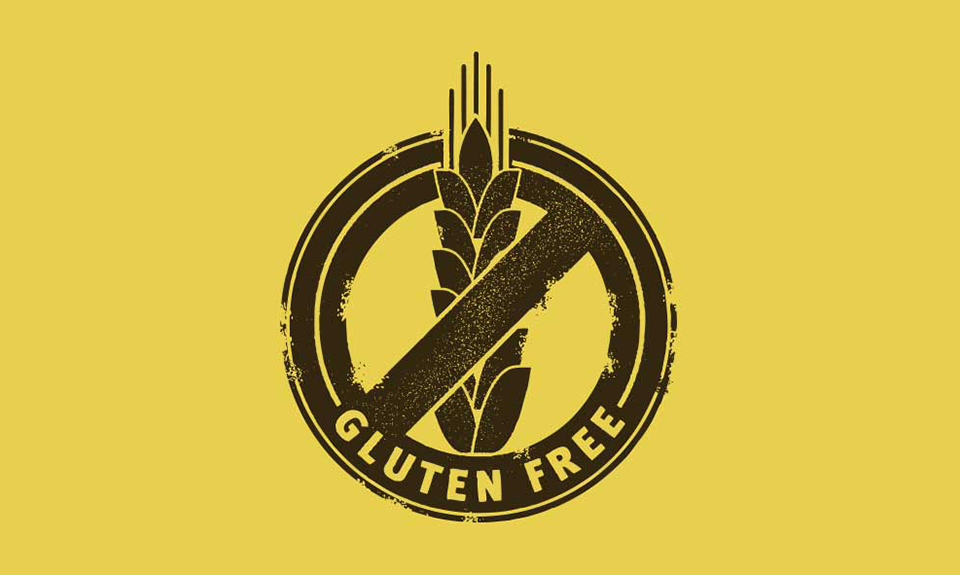 Logo senza glutine con spiga di grano barrata, sfondo giallo e testo Gluten Free in basso.